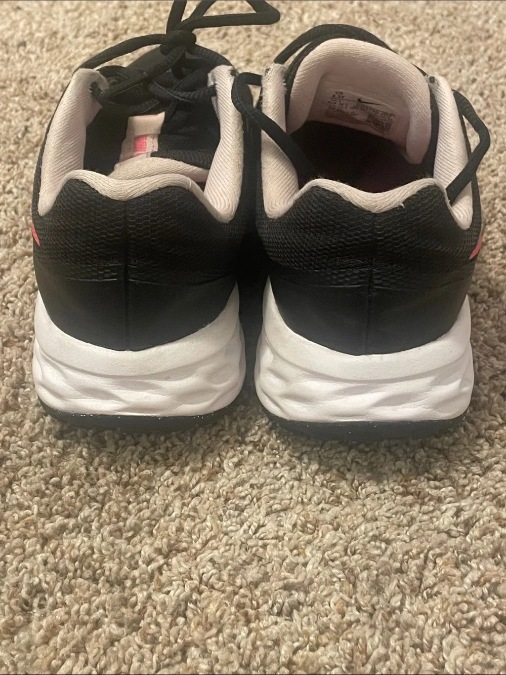 Nike Black Sneakers with Pink Swoosh Accents
